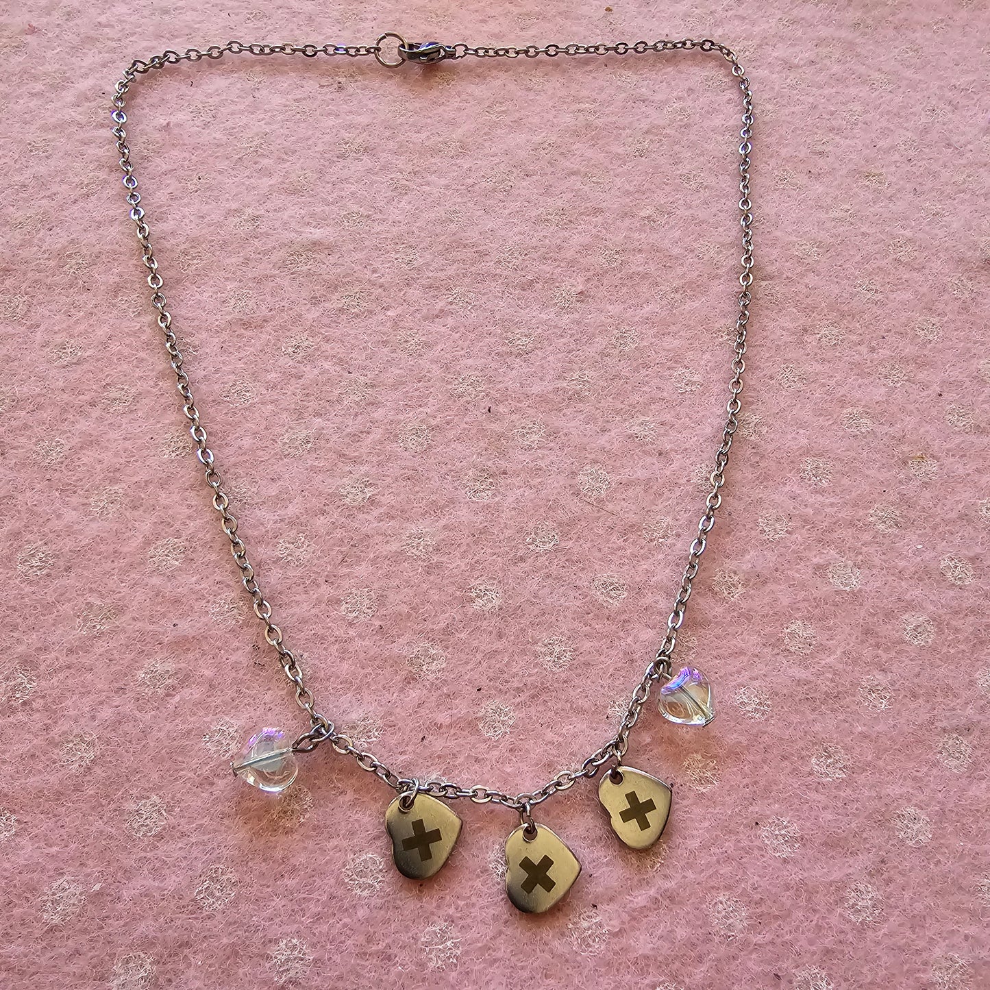 Txt necklace with heart pendants