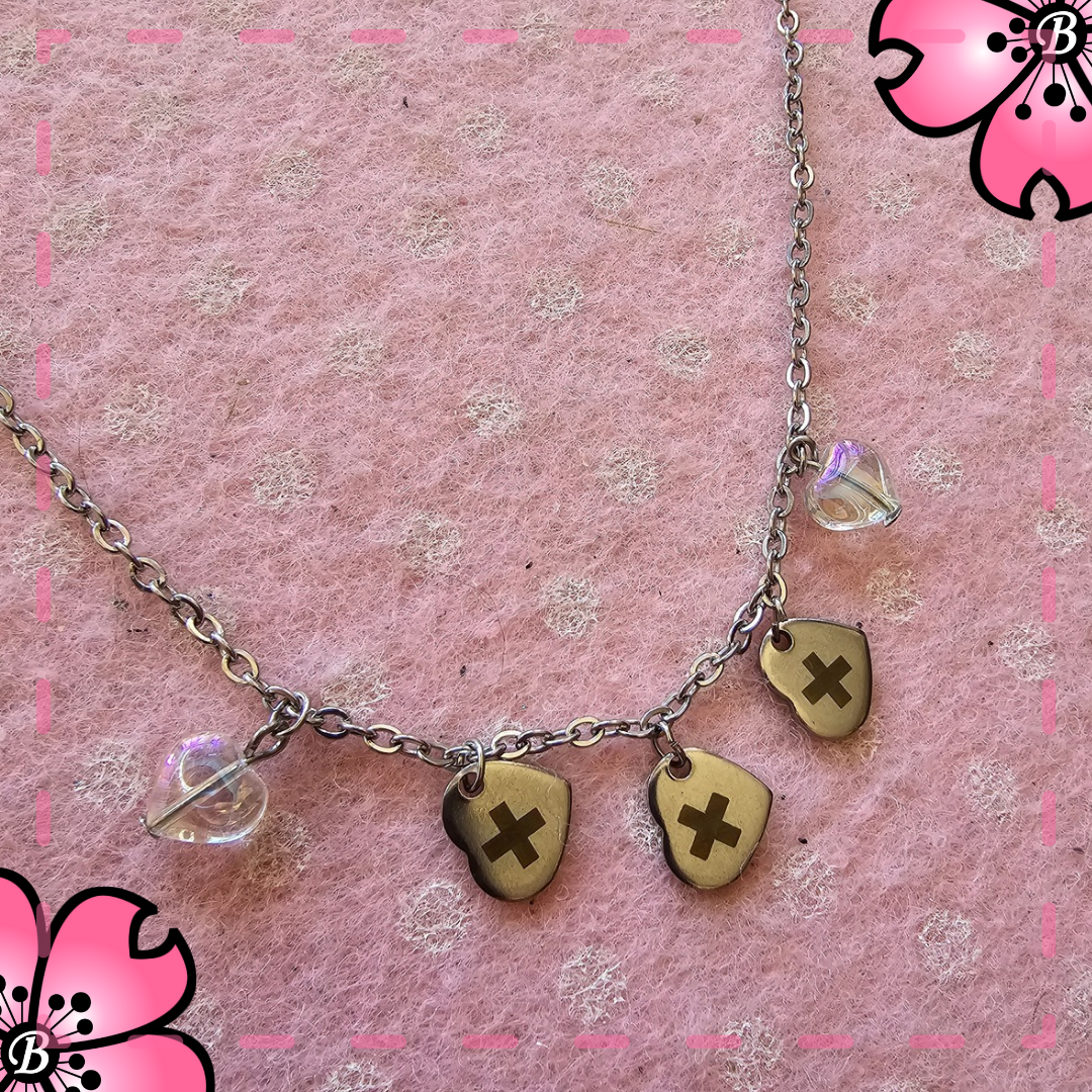 Txt necklace with heart pendants