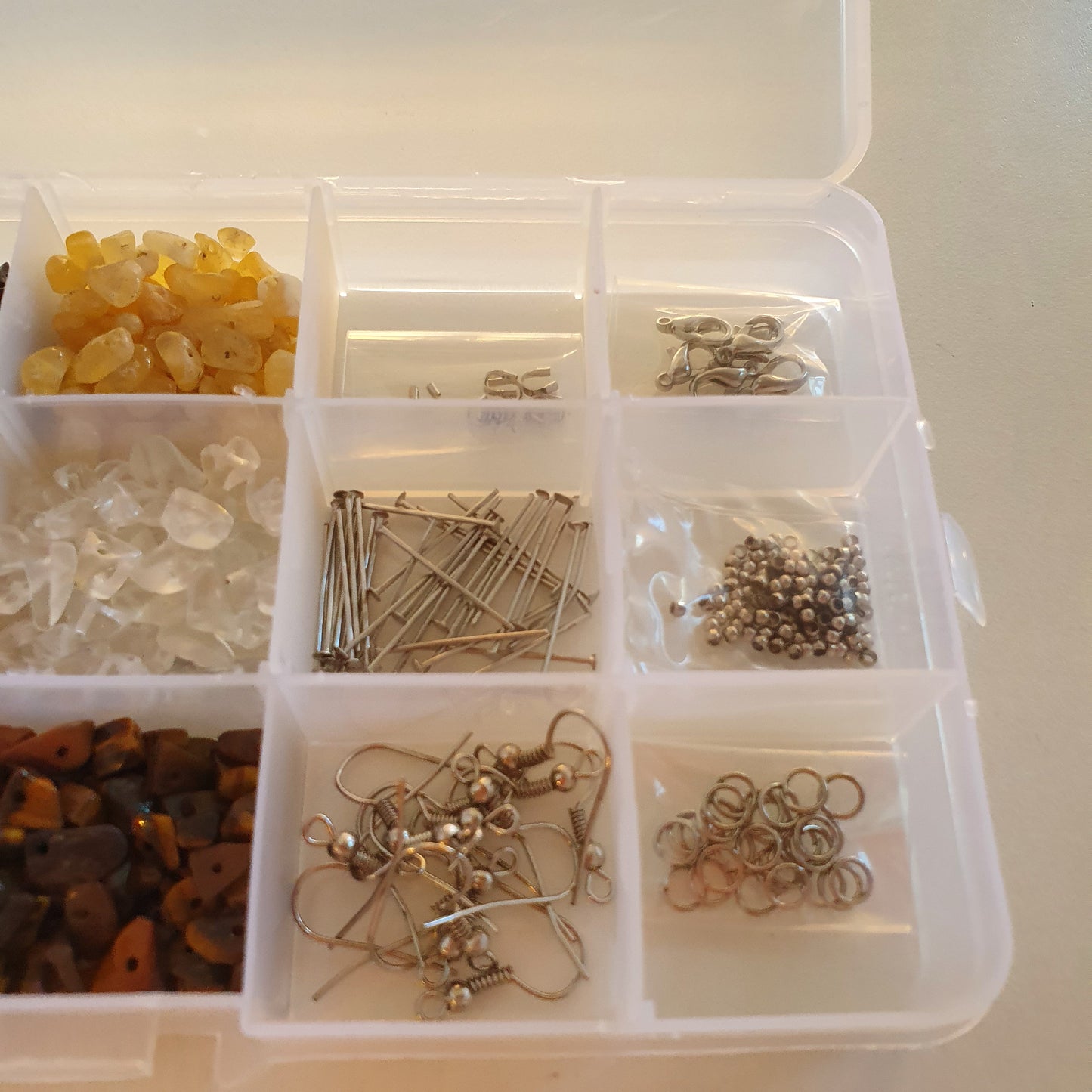 Box of semi-precious stones and small parts
