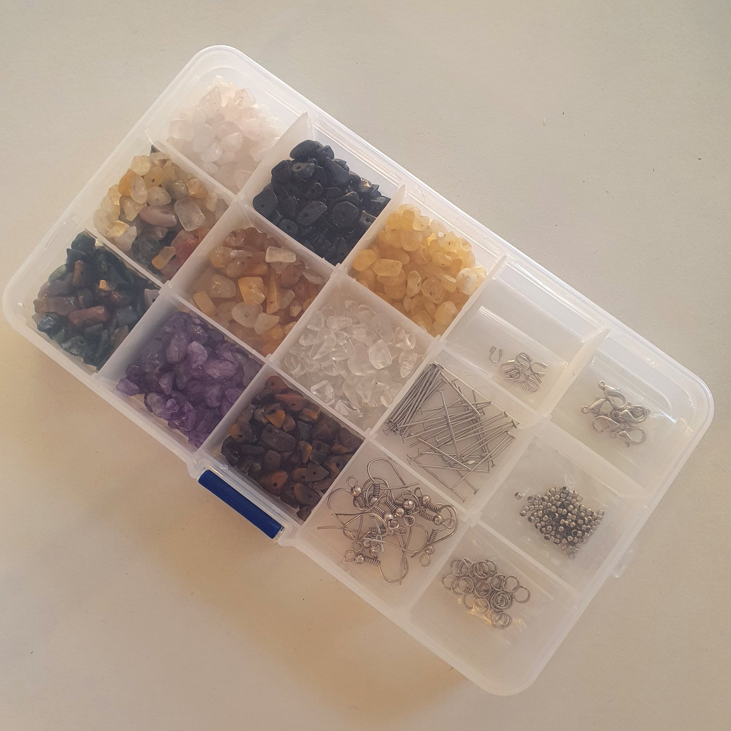 Box of semi-precious stones and small parts