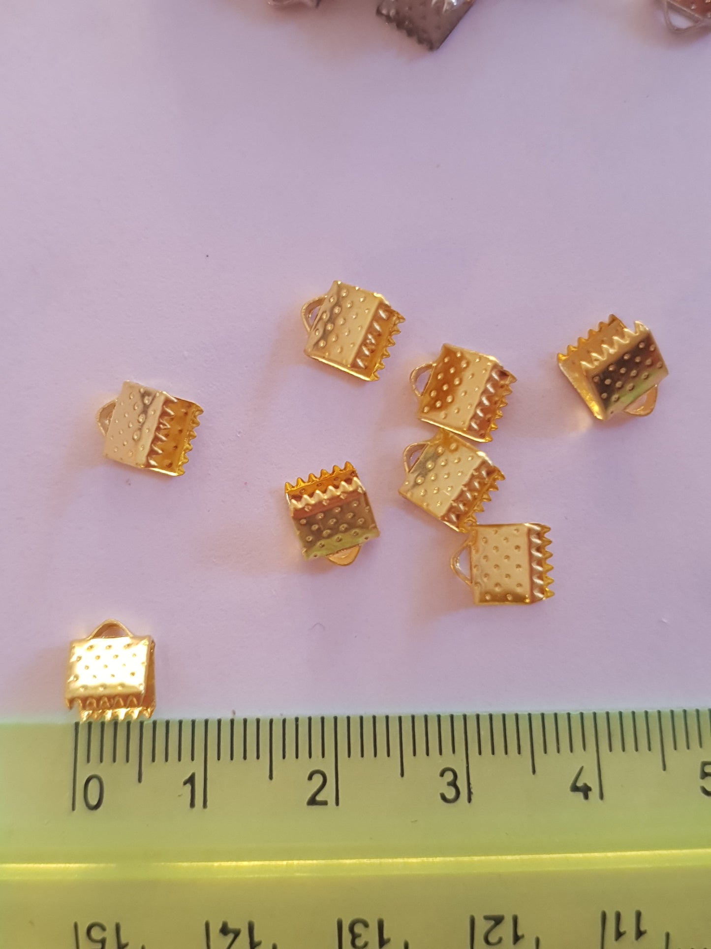 Terminals for ribbons, to create costume jewellery