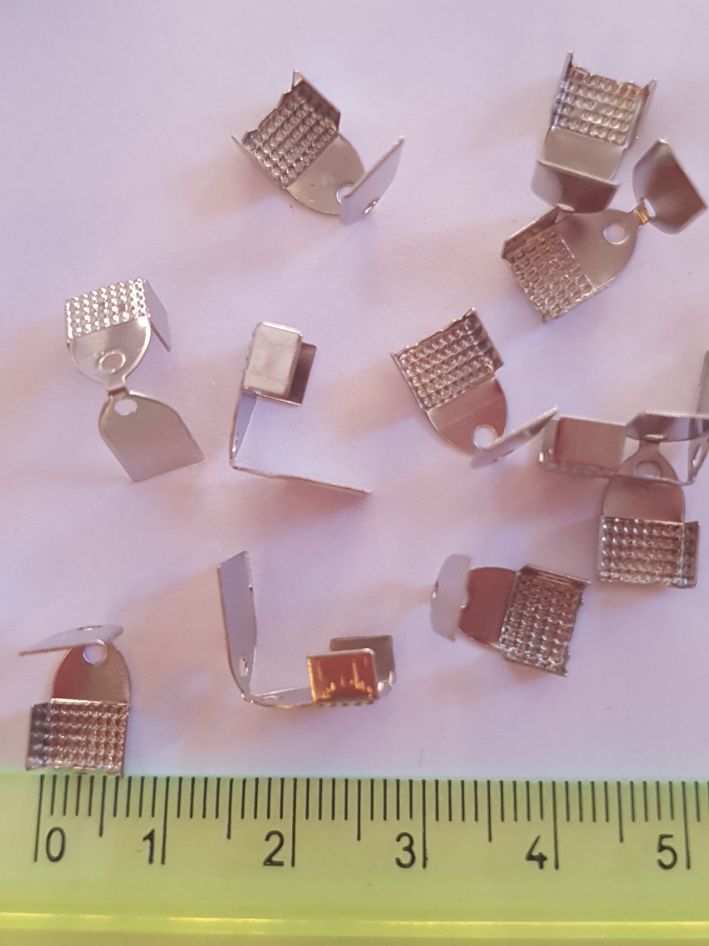 Terminals for ribbons, to create costume jewellery