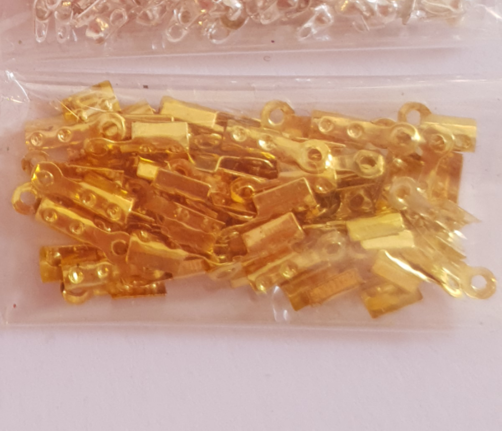 Terminals for costume jewelery (cable lug and knot cover)